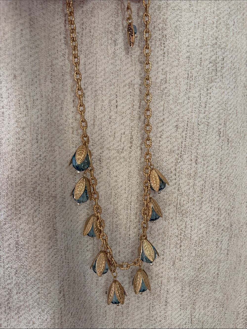 Plunder Gold-Tone Necklace with Teal Crystal Petal Charms